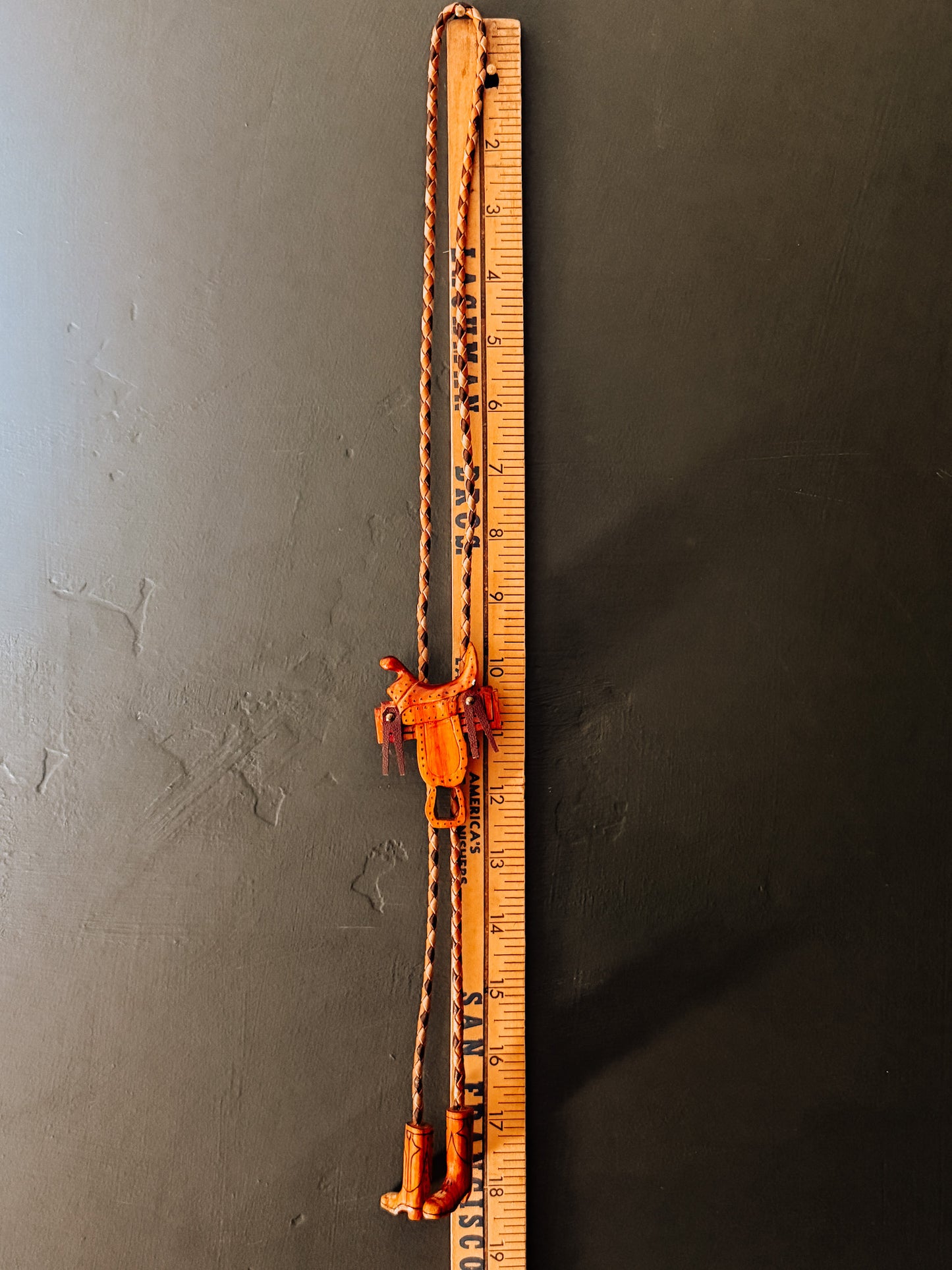 Wooden Saddle Bolo Tie with Boot Tips